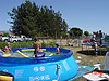 The kids in the pool and on the trampoline