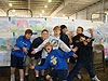 The boys in front of the pictures they colored