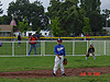 Ken and Jordan watching Tyler in the outfield