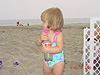 Jordan playing with a bottle of sand