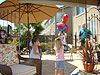 The kids pulling ribbons on the pinata