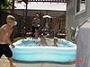 The boys playing in the pool