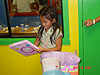 Katie opening up the gift from Tyler