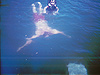Ken swimming underwater beside Tyler