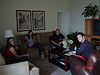 Everyone having a good time talking in the livingroom