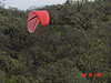 Another picture of a guy coming down with a parachute