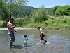 Ken, Jordan, and Tyler playing with rocks
