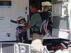 Ken helping Tyler with his helmet