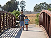 Tyler and Jordan on a bridge over Adobe Creek