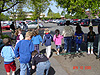 The kids walking through the parking lot