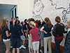 The kids looking closely at the wall
