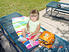 Jordan eating her lunch by the pool