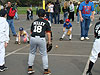 Tyler rolling the ball to a little kid