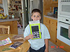 Tyler opening a gift from Ryan