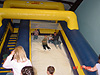 Scott, Catelyn, and Pat going down the slide