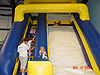 More kids going up the stairs for the slide