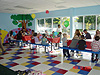 The kids sitting down to eat