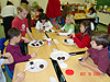 Tyler and his class decorating cupcakes