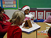 Kelly and Katie making a gingerbread house