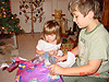 Tyler helping Jordan open her Barbies