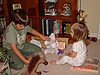 Tyler showing Jordan her new animal blocks