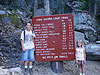 Tyler and Jordan next to the trail sign