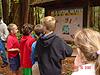 The kids checking out a litter sign