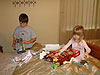 Tyler and Jordan opening one gift the Christmas Eve