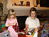 Jordan and Tyler opening their Christmas gifts