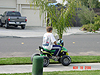 Dakota riding Tyler's old ATV