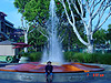 Tyler in front of a fountain outside Downtown Disney