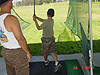 Ken helping Tyler with his swing