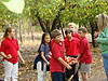 The kids carrying the apples