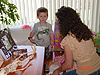 Heidi helping Hunter open some of his gifts