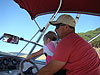 Ken helping Jordan drive the boat