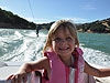 Jordan with Tyler wakeboarding behind her