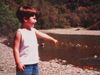 Tyler throwing rocks into the creek