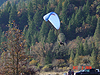 A guy coming down on a parachute