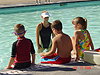 Tyler sitting on the edge of the pool