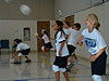The kids practicing their serving
