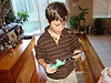 Tyler opening a small gift from us