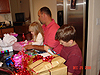 Jordan, Ken, and Tyler opening presents