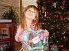 Jordan holding up some of her Disney dolls