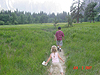 Jordan and Tyler walking down a path through a meadow