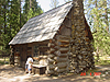 Tyler and Jordan by an old cabin